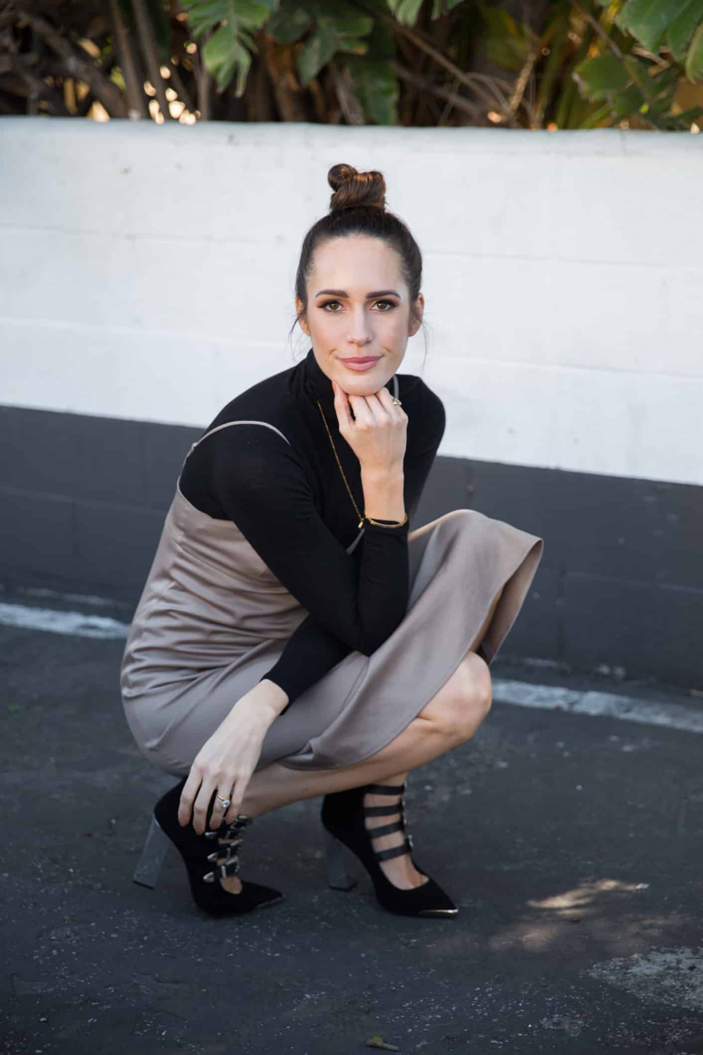 Louise Roe wearing a slip dress and heels