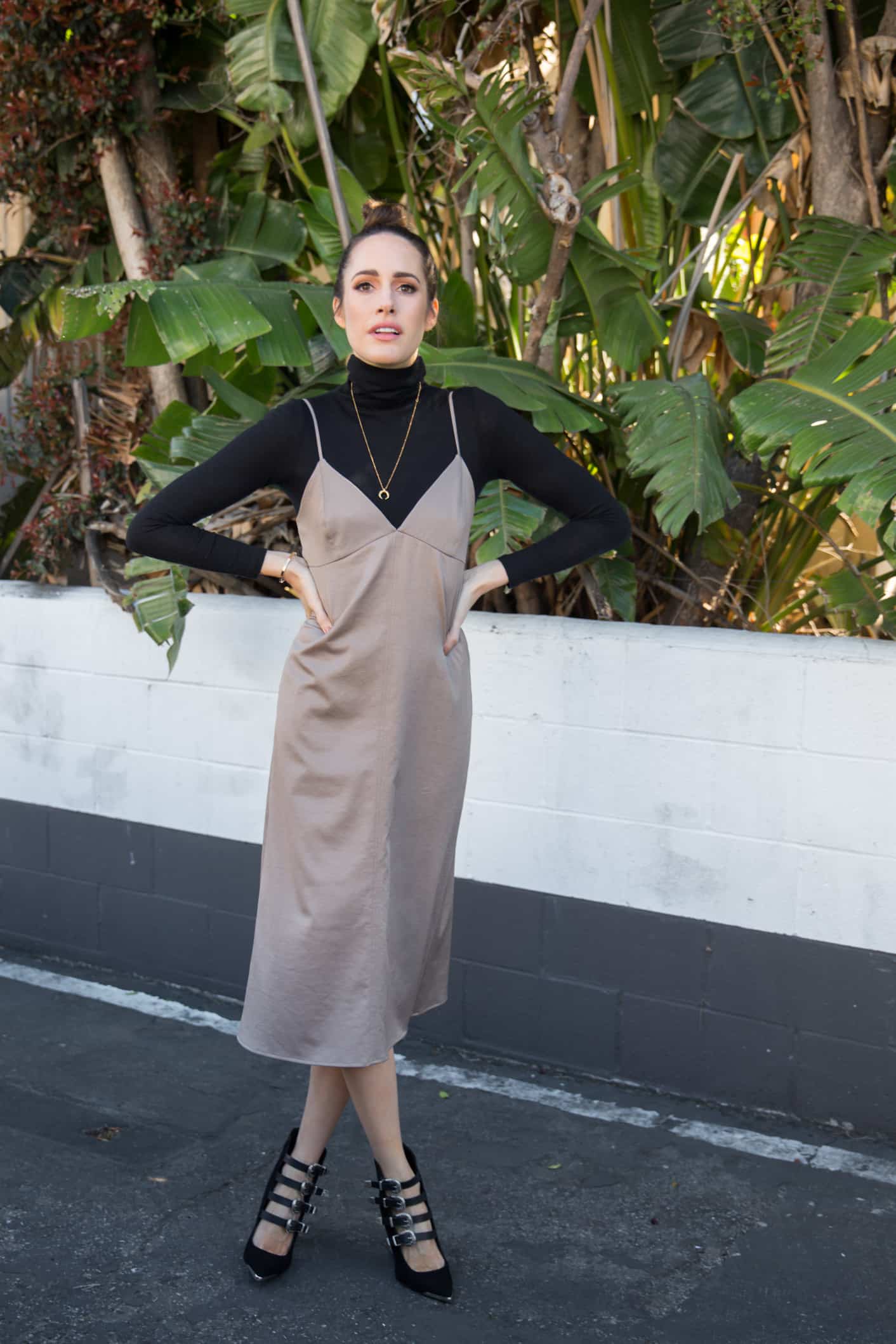 Louise Roe wearing a slip dress and heels