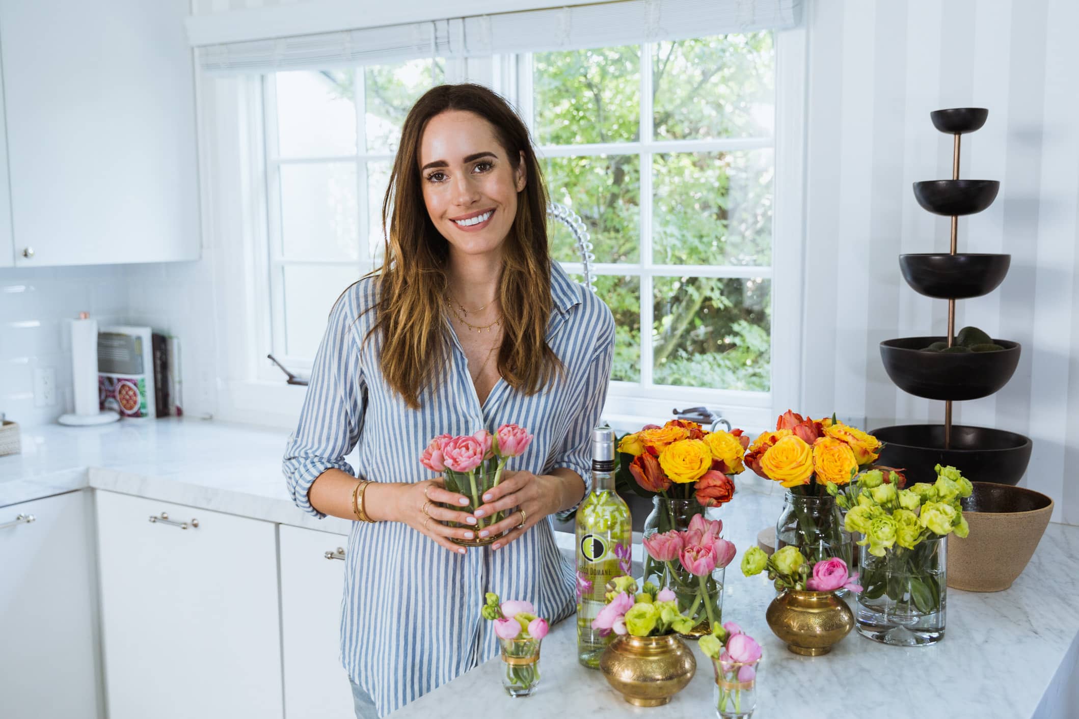 Louise Roe making a Slim Aarons inspired summer party flower arrangement at her Los Angeles home