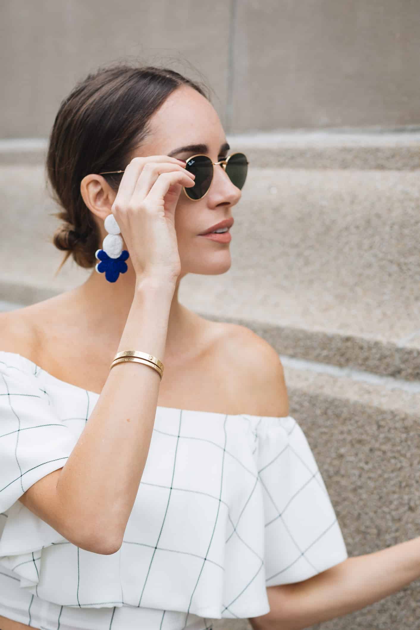 Louise Roe wearing off shoulder top in NYC