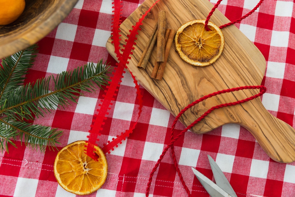 Louise Roe making dried orange christmas oraments and cinnamon stick christmas ornaments for the holidays