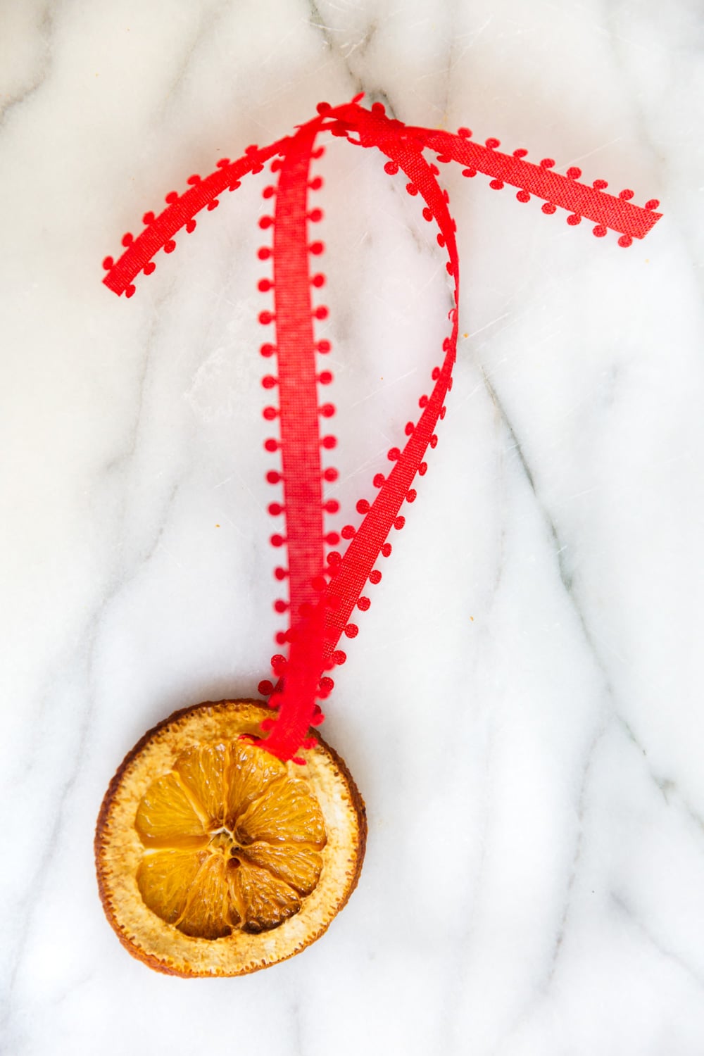 Louise Roe making dried orange christmas oraments and cinnamon stick christmas ornaments for the holidays