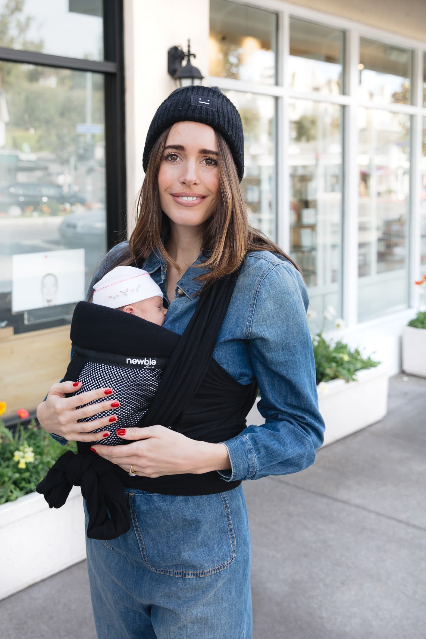 Louise Roe wearing Newbie Love baby wrap carrier