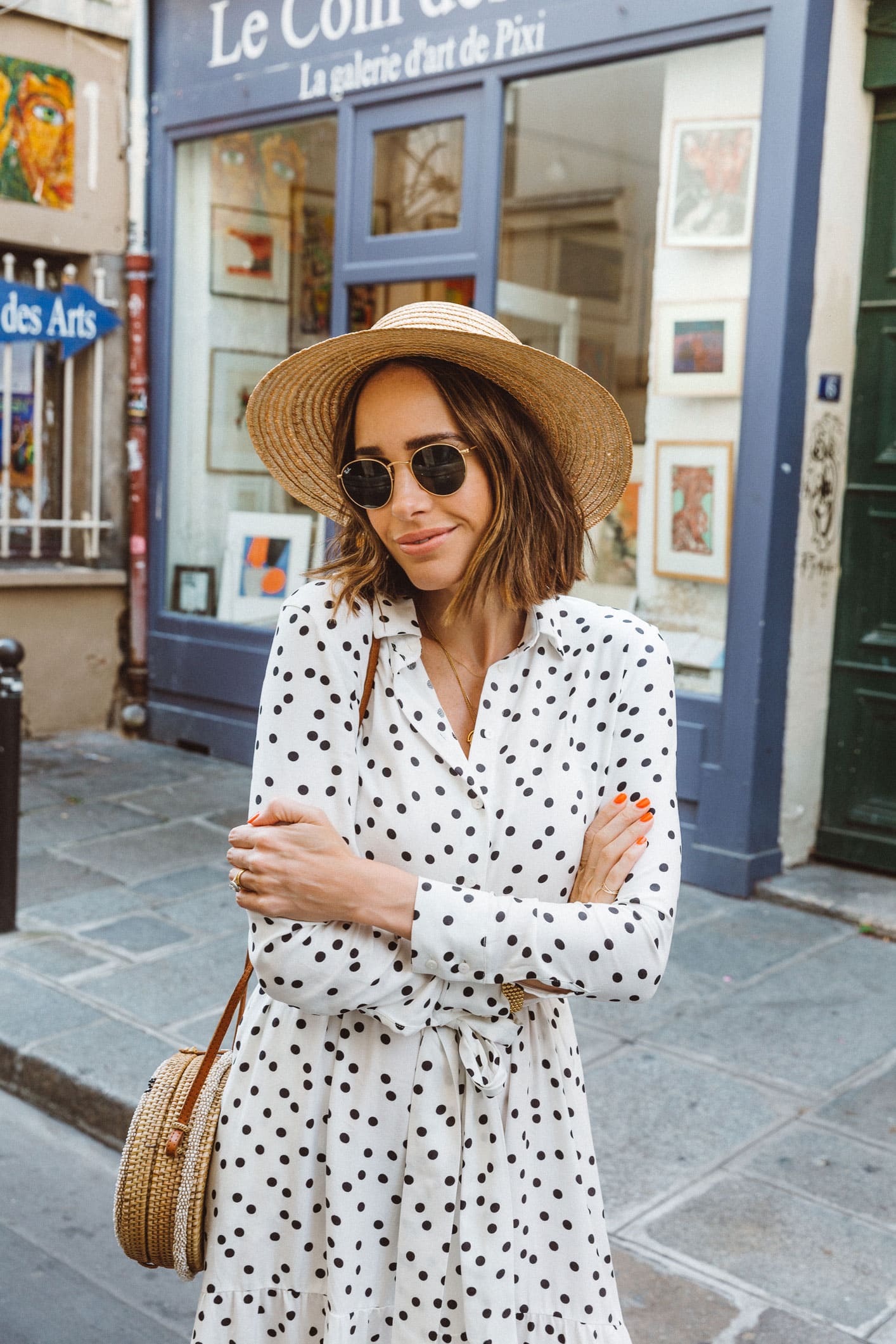 Louise Roe Wearing Polka Dot Dress White Sneakers and Straw Bag In Paris