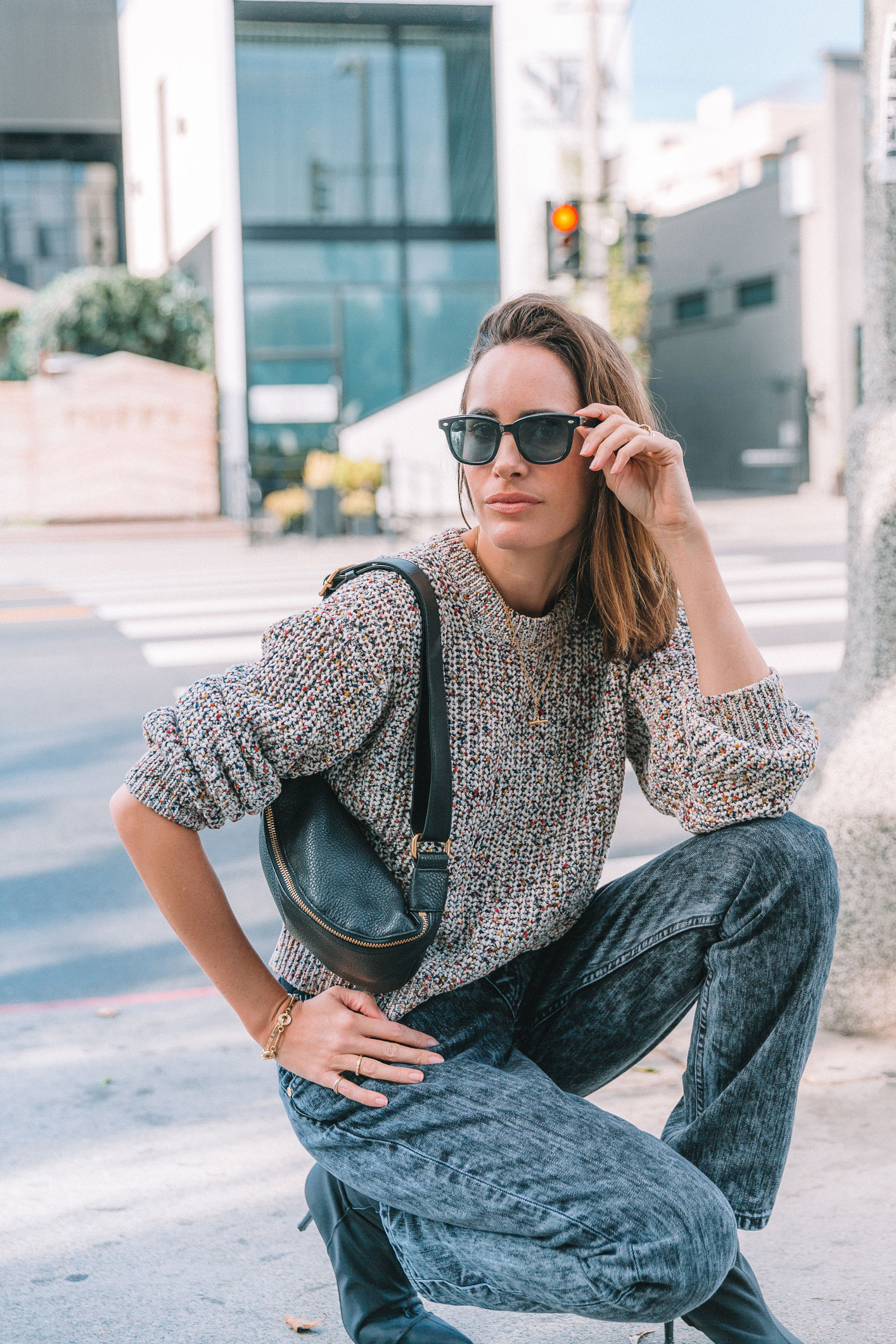 Louise Roe wearing 2019 trends stonewash jeans and chunky knit sweater