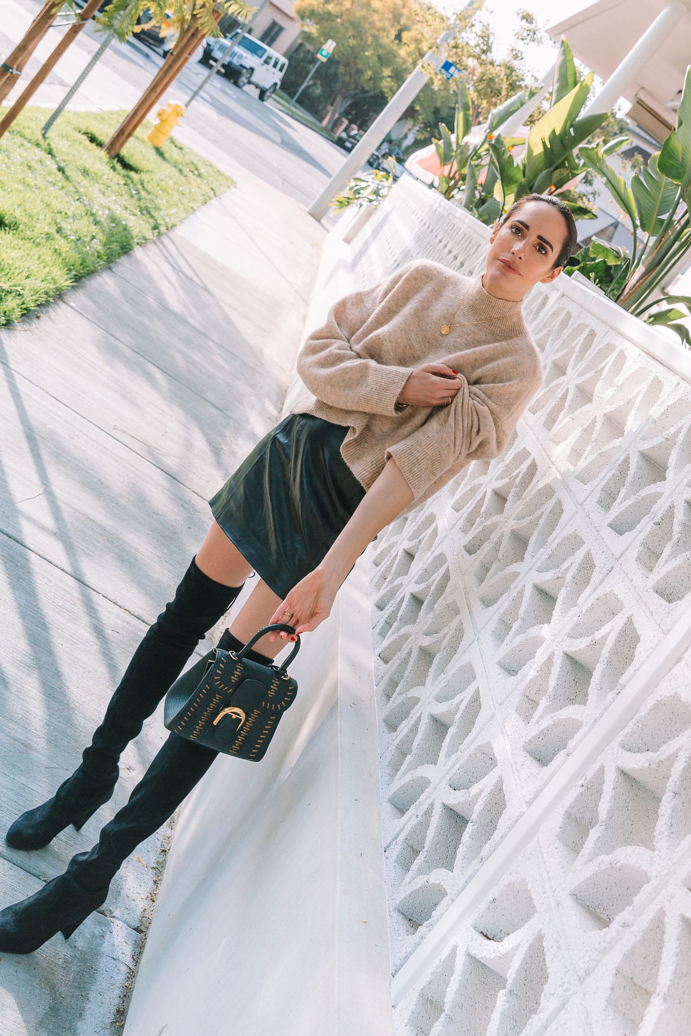 Louise Roe wearing Spring leather mini skirt and boots